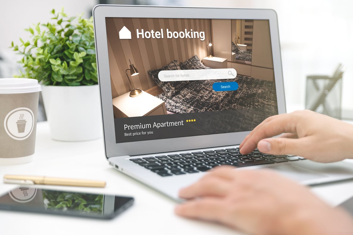 Man makes hotel reservations via the internet